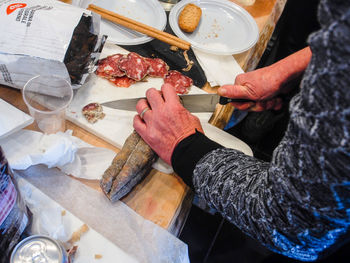 High angle view of person preparing food on table