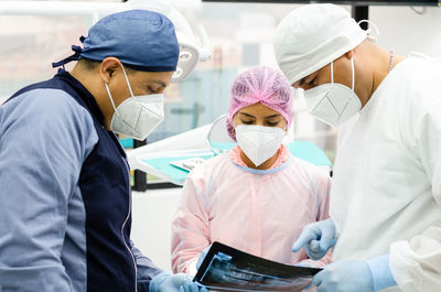 Rear view of people working