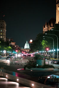 Illuminated buildings in city at night