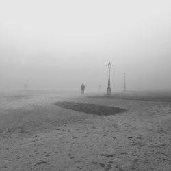 Scenic view of landscape against sky during winter