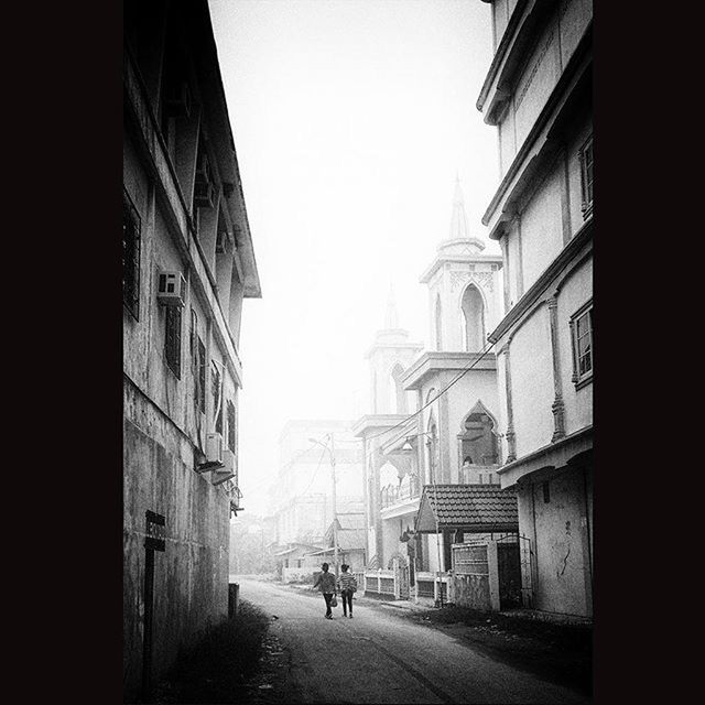 architecture, built structure, building exterior, clear sky, city, street, arch, travel destinations, the way forward, walking, facade, incidental people, history, person, men, city life, famous place, travel, building