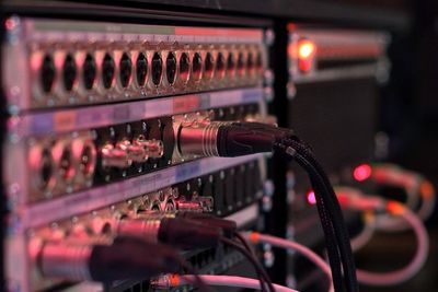 Close up of cables, on the rear of a sound desk 