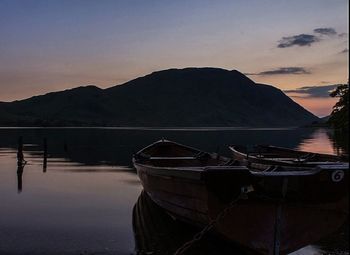 Scenic view of calm lake at sunset