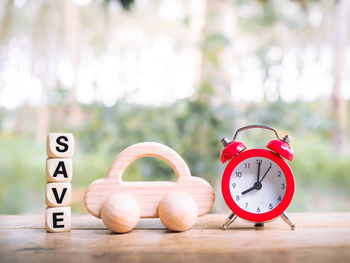 Close-up of clock on table