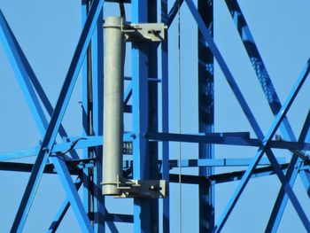 Low angle view of bridge against blue sky