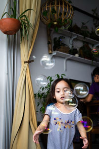 Smiling girl standing at home