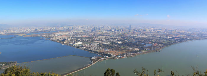 Aerial view of cityscape against sky