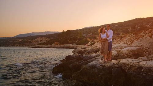 Young adult heterosexual couple at romantic date.young man and woman cuddling and look to each other