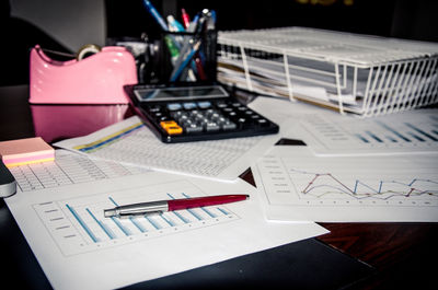 High angle view of graph papers on table