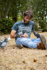 Young woman sitting on field