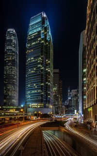 Illuminated modern buildings in city at night