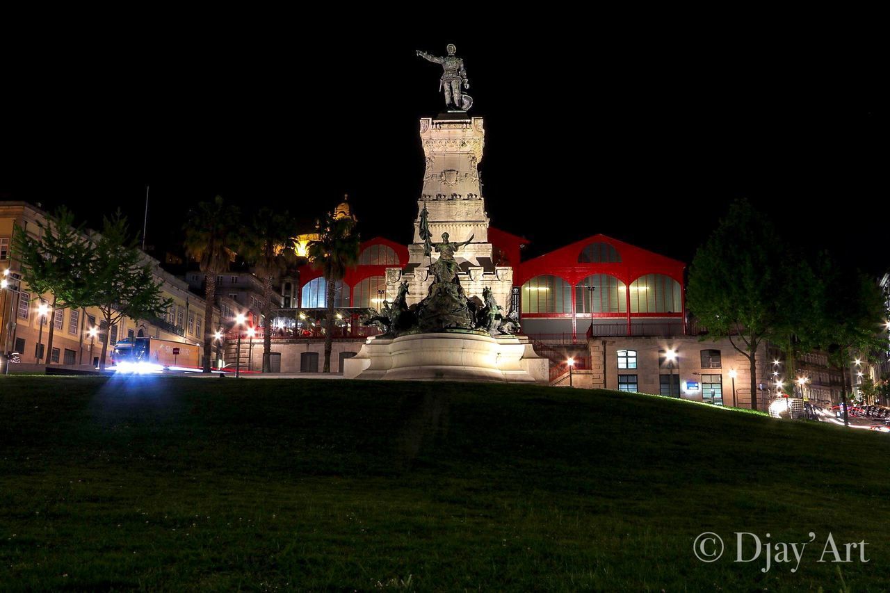 STATUE OF BUILDING AT NIGHT