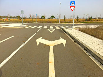 Arrow symbols on road in city