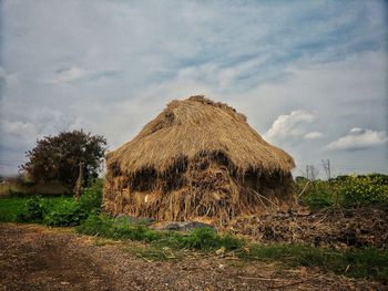 House on field against sky