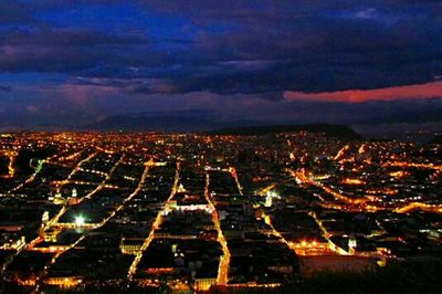 Aerial view of illuminated cityscape at night