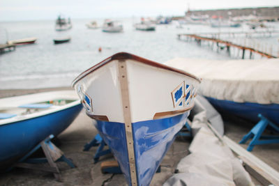 Boat moored at harbor