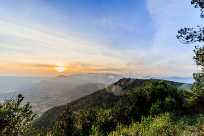 Scenic view of mountains against sky during sunset