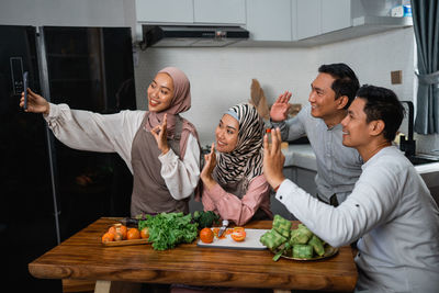 Side view of woman preparing food at home