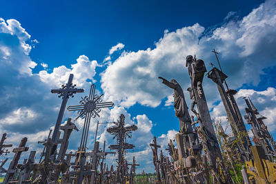 Low angle view of statue against cloudy sky