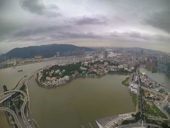 High angle view of bridge over river amidst buildings in city