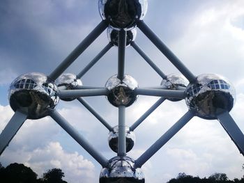 Low angle view of built structure against cloudy sky