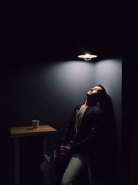 Young man sitting indoors