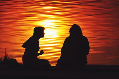 Silhouette people at sunset