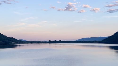 Scenic view of lake against sky during sunset