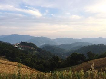 Scenic view of landscape against cloudy sky