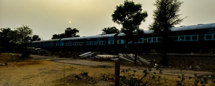 Train on railroad track against sky