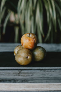 Close-up of plums on table