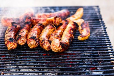 High angle view of meat on barbecue grill