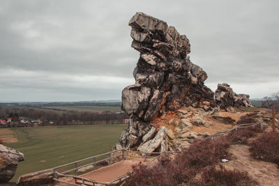 Rock formation on land against sky