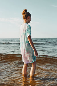 Full length of boy standing on beach