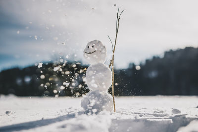 Close-up of snow against sky