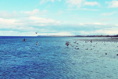 Scenic view of sea against cloudy sky