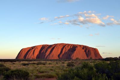 Rock formations on landscape against sky