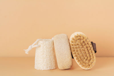 Eco friendly bathroom accessories on beige background. beauty, sustainable and wellness concept