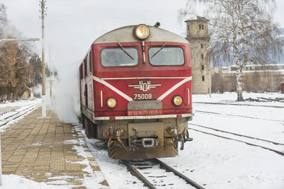 Train on railroad tracks during winter