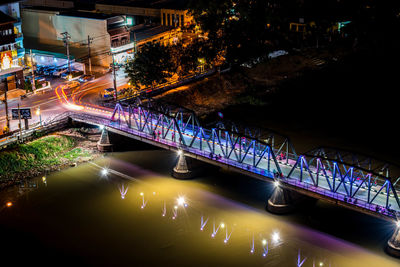 High angle view of illuminated bridge over river at night