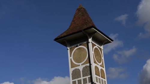 Low angle view of church against sky on sunny day