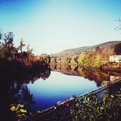 Scenic view of calm lake against clear sky