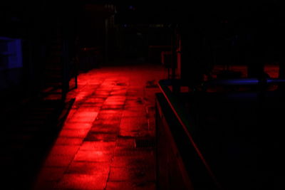 Illuminated tunnel at night