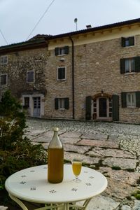 View of drink on table against building