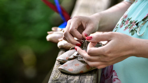 Close-up of woman holding hands