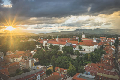 Cityscape against cloudy sky