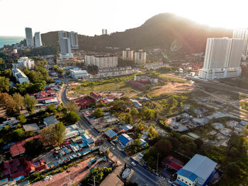 High angle view of buildings in city against sky