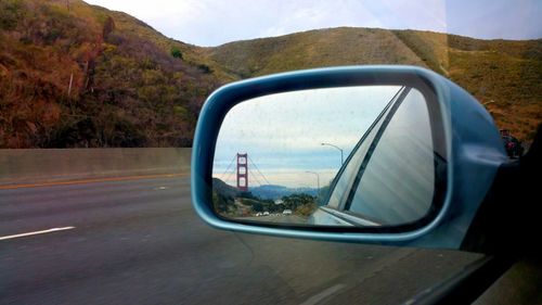 Reflection of road on side-view mirror