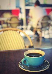 Close-up of coffee cup on table in cafe