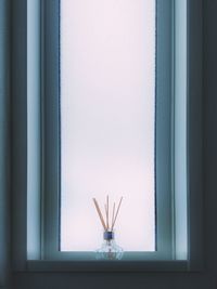 Close-up of glass window on wall at home